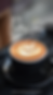 a picture of a delicious cup of coffee with a flower shaped into the milk.